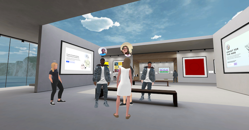A number of attendees chatting at the Interledger Community Gallery in Spatial