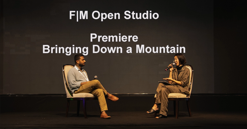 The Bringing Down a Mountain's director Subhashish Panigrahi and Interledger Community Ambassador Hollis Wong-Wear discuss the film at the premiere during Interledger Summit, Costa Rica.