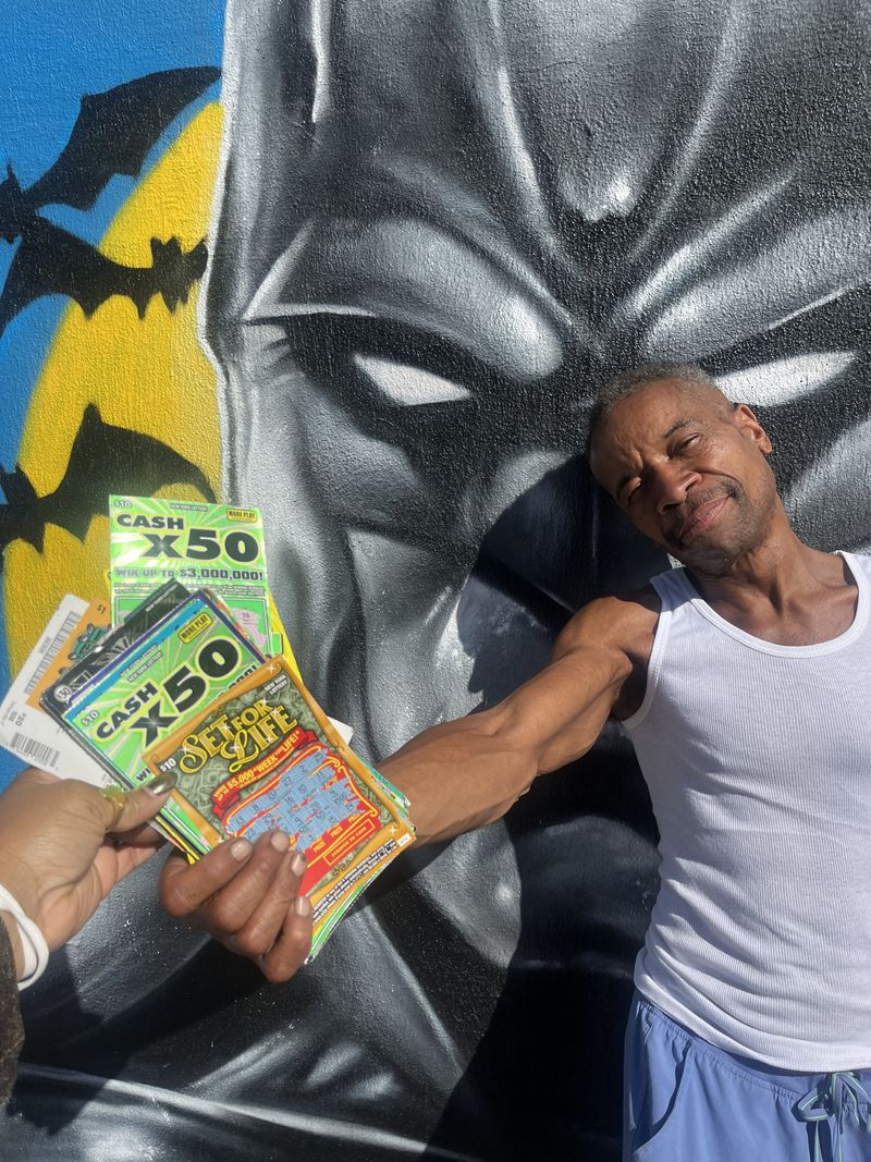 Our Lead Community Liaison, Mike, handing off Recycled Lottery Tickets